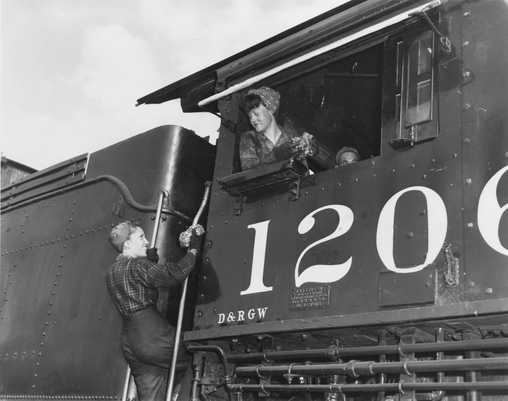 Women working on a train, World War II era.