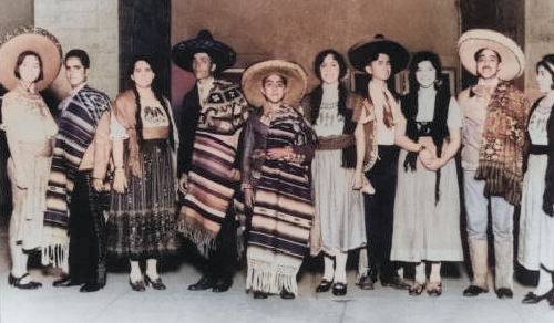 A group of people dressed in traditional Spanish clothing.