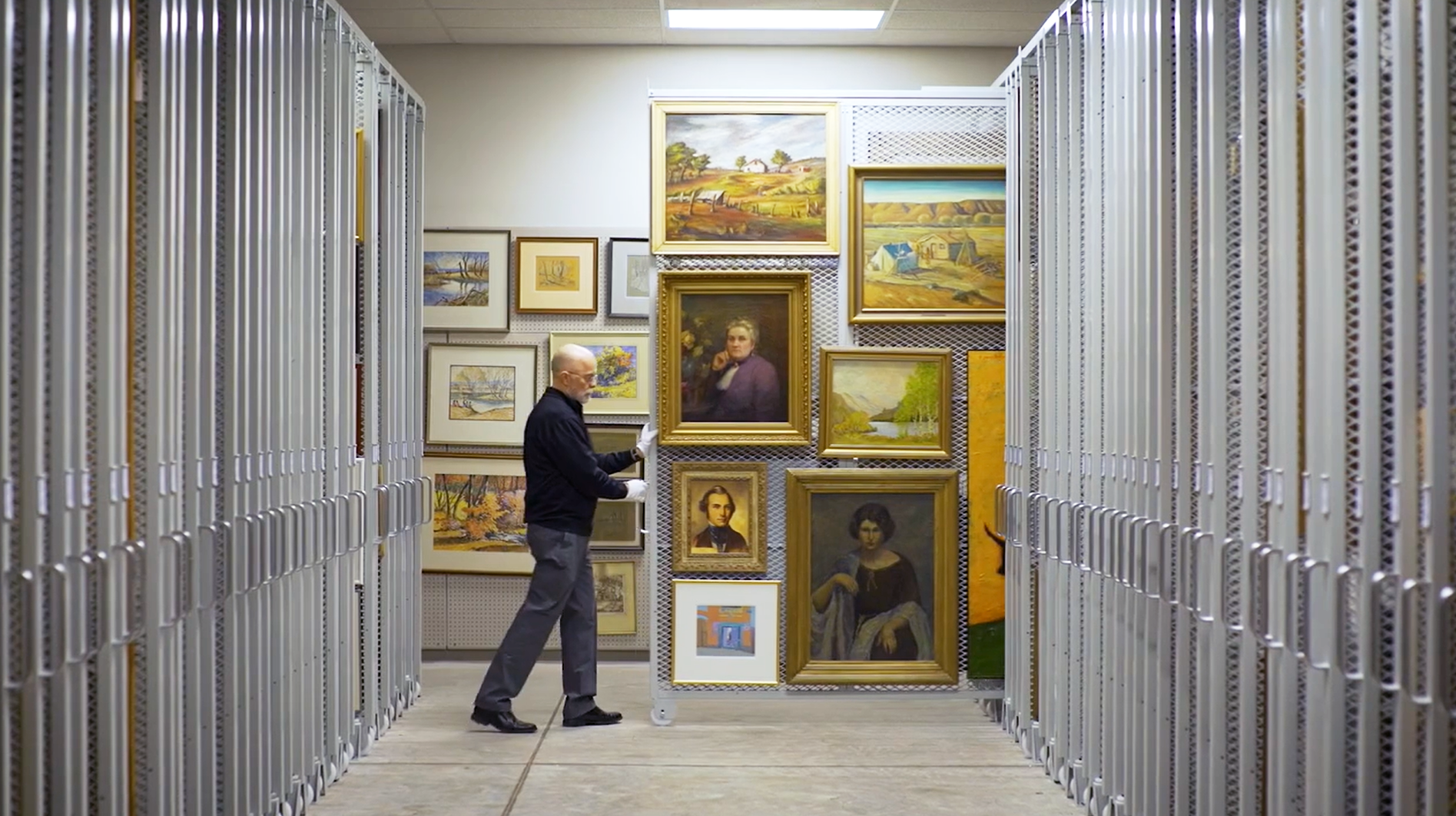 Preservation expert transfers historical paintings.