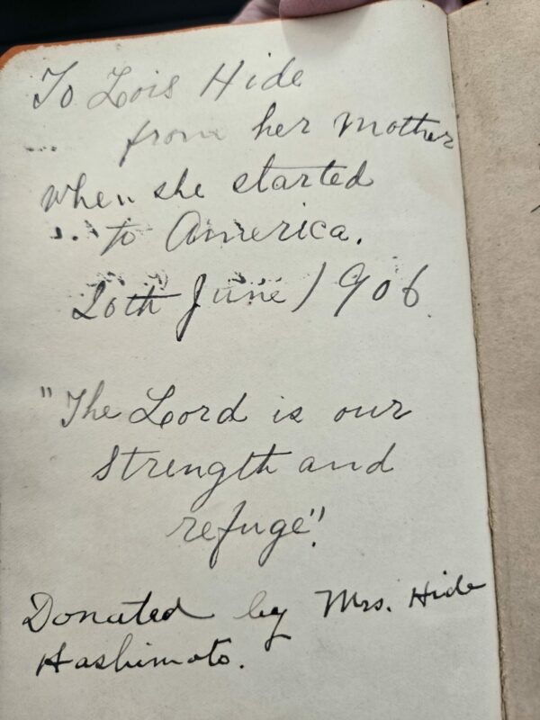 Inscription in a book dated June 26, 1906, with handwritten dedication and Bible quote.